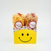 Yellow basket with a smiley face on it.