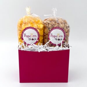 solid brick red gift box with two bags of popcorn